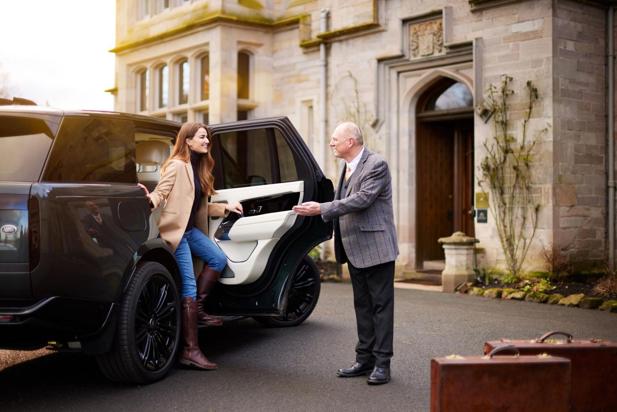 Schloss Roxburghe, Part Of Destination By Hyatt Bagian luar foto A chauffeur opening the car door for a passenger